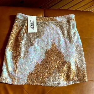 12th Tribe white and gold sequin skirt. Size medium.
